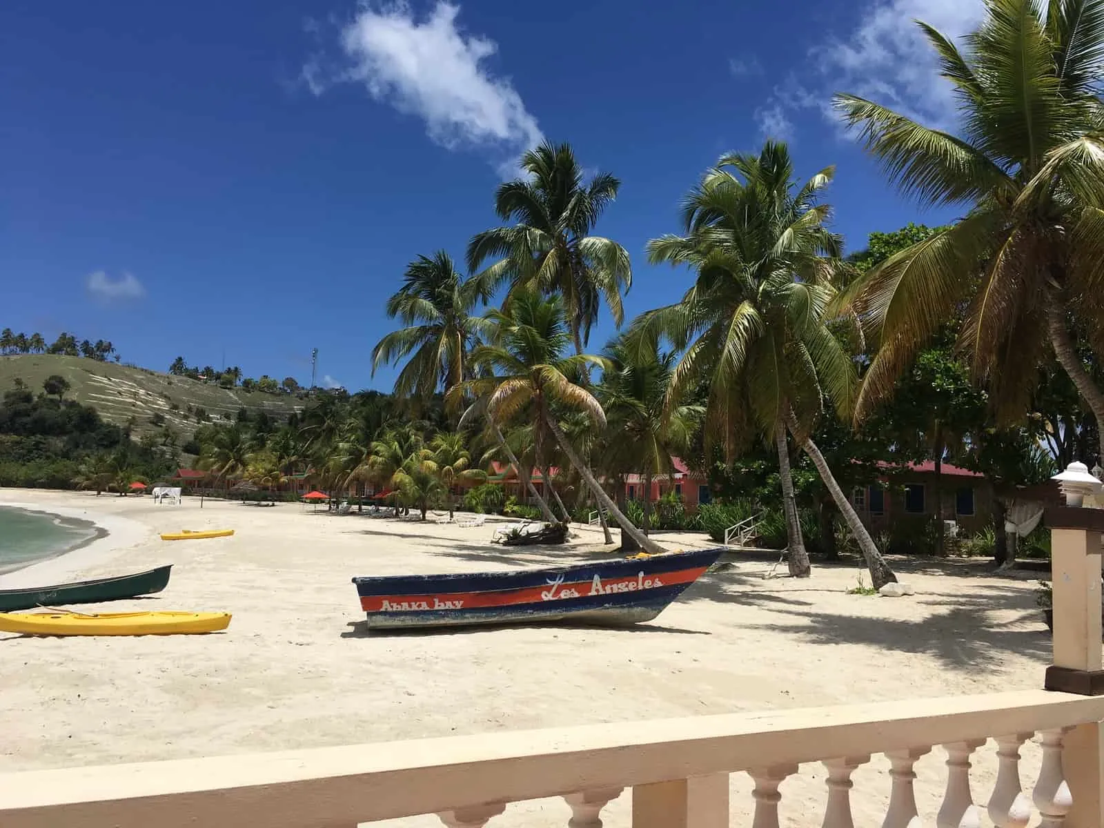 red and white boat on beach during daytime